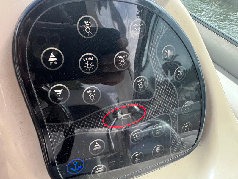 Slide: The Image of Control panel of a 2005 Sea Ray 340 Sundancer boat with various function buttons. - 7