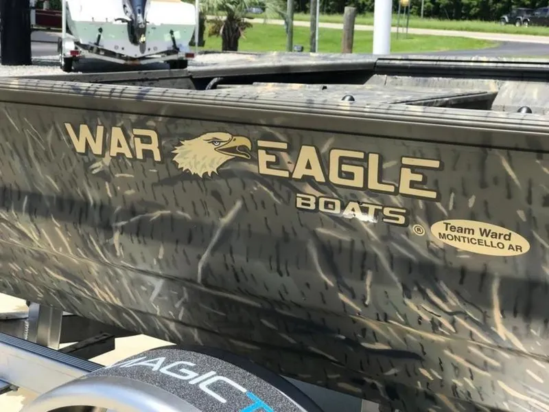 Slide: The Image of 2026 War Eagle 754LDV boat on trailer, showcasing brand logo and design details. - 3