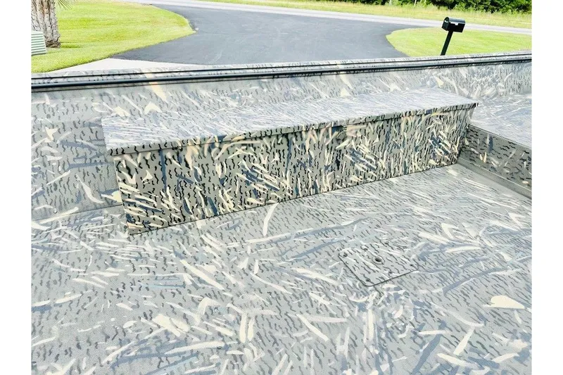 Slide: The Image of 2026 War Eagle 754LDV boat interior with camouflage pattern and seating. - 4