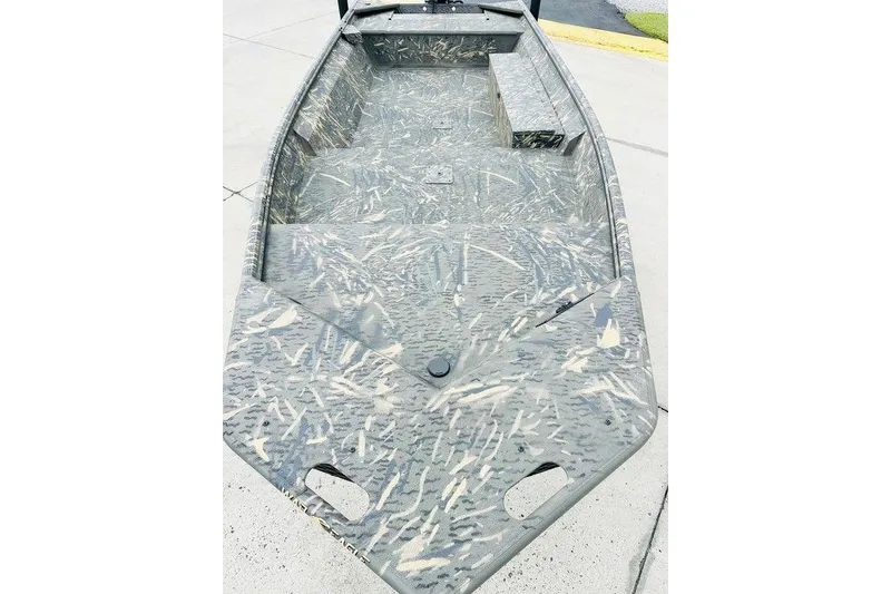 Slide: The Image of 2026 War Eagle 754LDV boat with camouflage pattern on concrete surface. - 5
