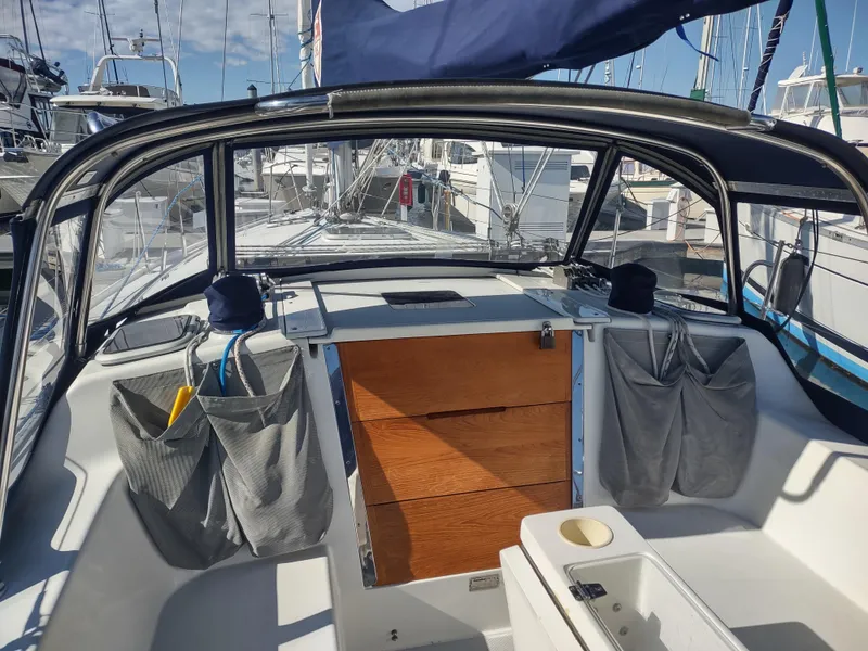 Slide: The Image of Cockpit of a 2002 Catalina 36 MkII sailboat, featuring storage pockets and wooden hatch. - 18