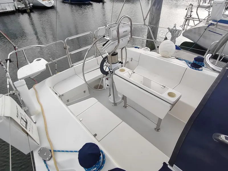 Slide: The Image of Cockpit of 2002 Catalina 36 MkII sailboat with steering wheel and seating. - 19