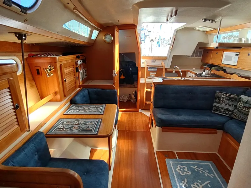 Slide: The Image of Interior of 2002 Catalina 36 MkII sailboat with wood finish and blue upholstery. - 35
