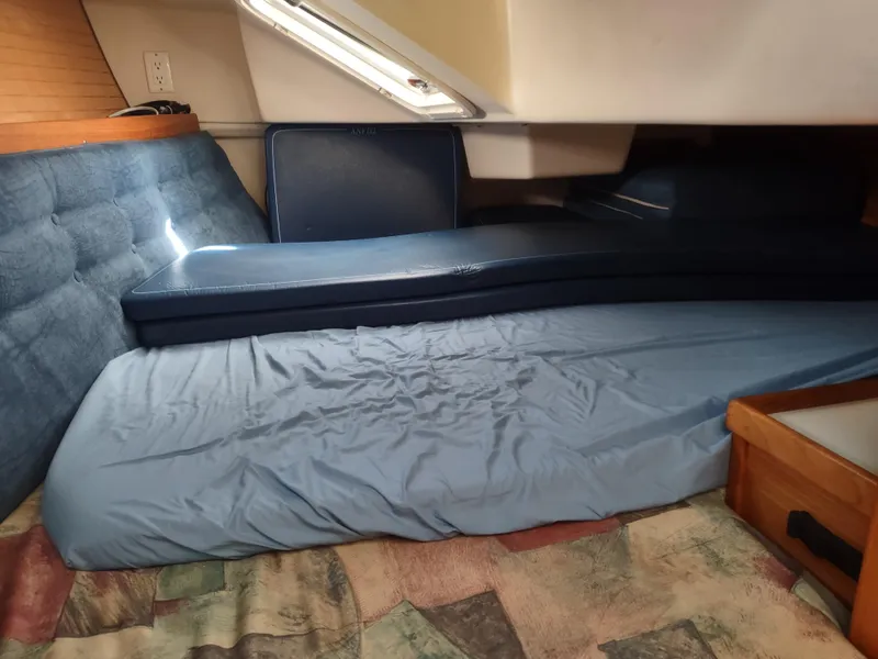 Slide: The Image of Cozy cabin interior of 2002 Catalina 36 MkII sailboat with blue cushions and bedding. - 37
