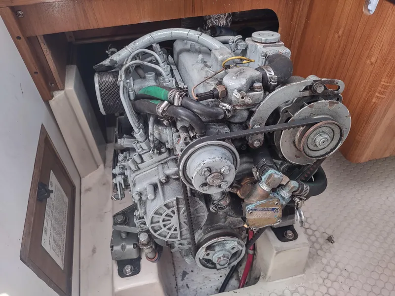 Slide: The Image of Engine compartment of a 2002 Catalina 36 MkII sailboat, showcasing mechanical components. - 43