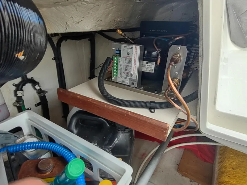 Slide: The Image of Electrical components and storage area inside a 2002 Catalina 36 MkII sailboat. - 47