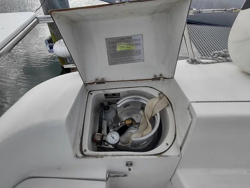 Slide: The Image of Open propane storage compartment on 2002 Catalina 36 MkII sailboat deck. - 48
