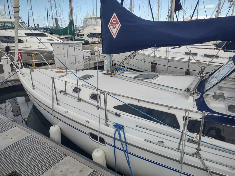 Slide: The Image of Catalina 36 MkII sailboat docked at marina, 2002 model, with blue sail cover. - 8