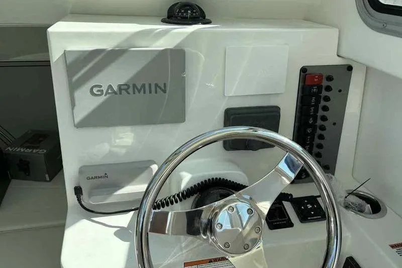 Slide: The Image of Steering console of 2026 Parker 2220 SC boat with Garmin navigation system. - 10