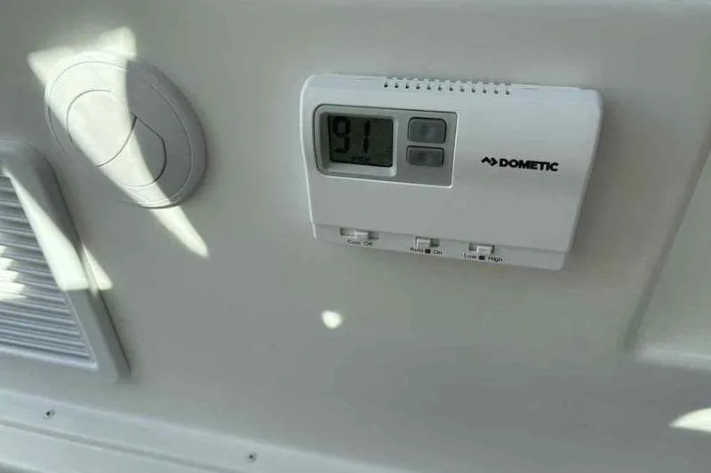 Slide: The Image of Thermostat on Parker 2220 SC boat, displaying 91 degrees, Dometic brand, 2026 model. - 13