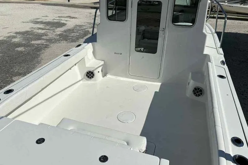 Slide: The Image of 2026 Parker 2220 SC boat interior with spacious deck and seating area. - 15