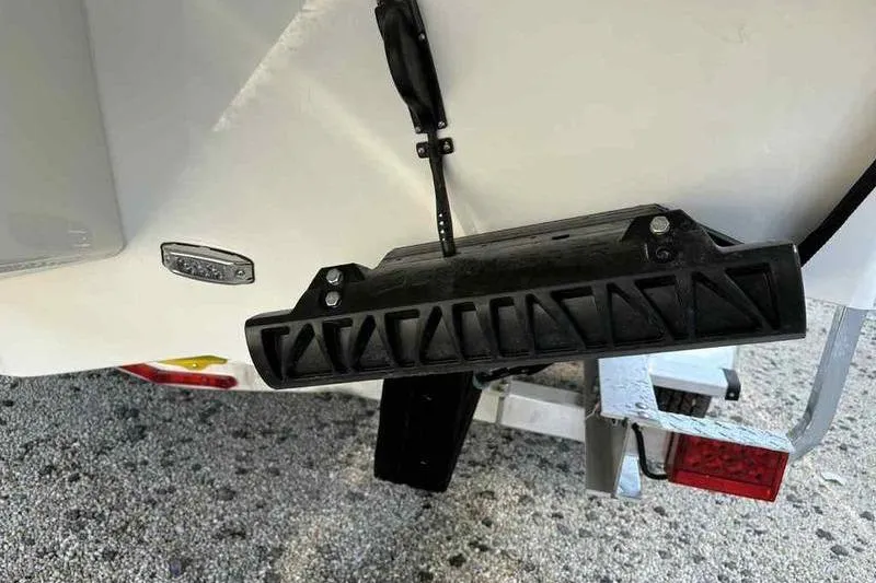 Slide: The Image of Rear view of 2026 Parker 2220 SC boat on trailer, showing hull and trailer details. - 16