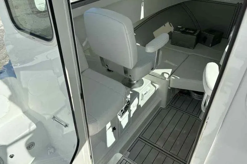 Slide: The Image of Interior of 2026 Parker 2220 SC boat with seating and storage area. - 7