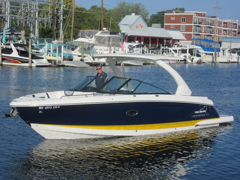 The Image of 2021 Chaparral 307 SSX boat docked in a marina. - 0