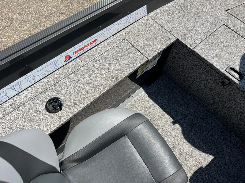 Slide: The Image of 2021 MirroCraft 145 Side Console interior with fishing ruler and seating. - 11