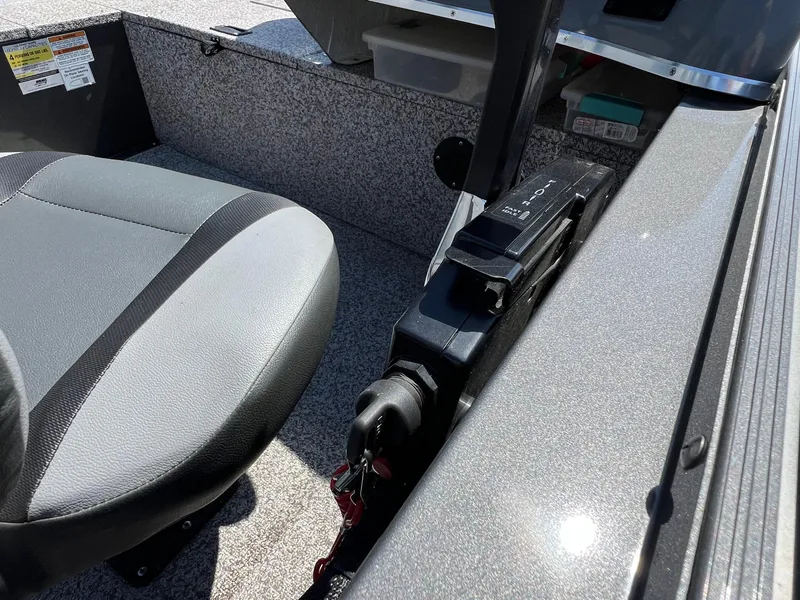 Slide: The Image of 2021 MirroCraft 145 Side Console interior with seat and control panel. - 19