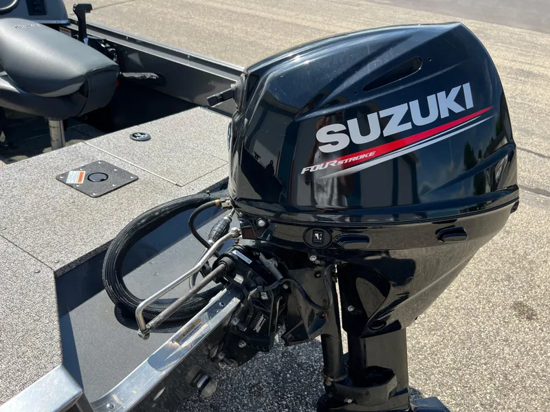 Slide: The Image of 2021 MirroCraft 145 Side Console boat with Suzuki four-stroke outboard motor. - 3