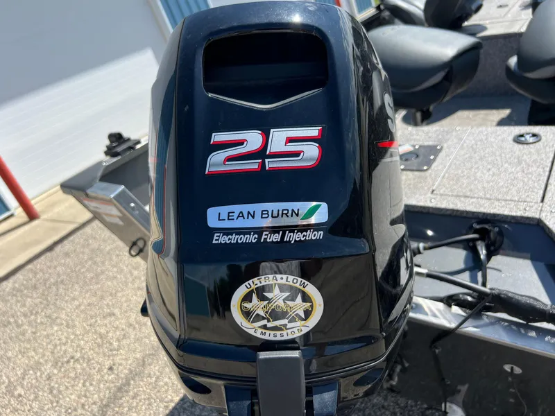 Slide: The Image of Outboard motor on 2021 MirroCraft 145 Side Console boat, featuring lean burn technology. - 4