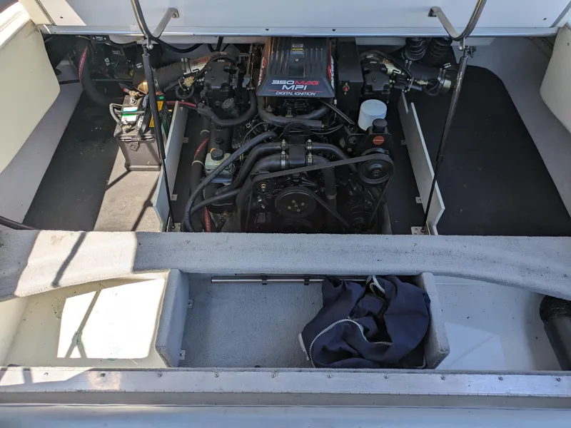 Slide: The Image of Engine compartment of a 1998 Cobalt 200 boat, featuring a 5.7L V8 engine. - 18