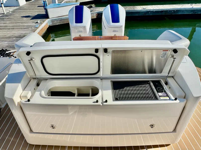 Slide: The Image of 2025 Tiara Yachts 43 LE with outdoor kitchen and grill on deck. - 15