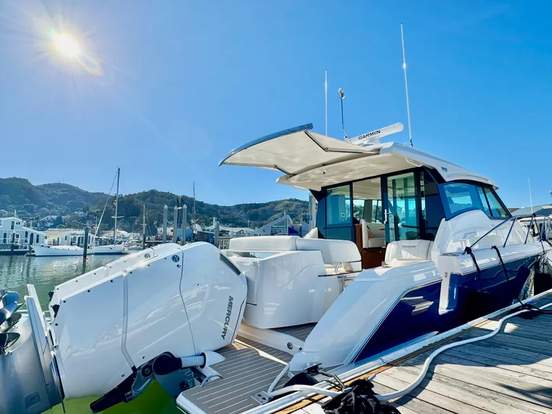 Slide: The Image of 2025 Tiara Yachts 43 LE docked under clear blue sky. - 16