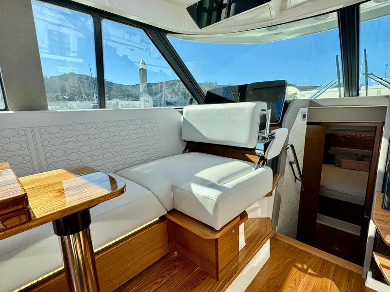 Slide: The Image of Luxurious interior of 2025 Tiara Yachts 43 LE with elegant seating and wooden accents. - 19
