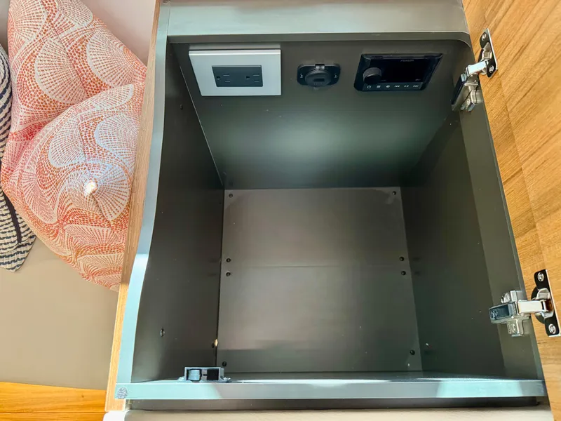 Slide: The Image of Storage compartment with electrical outlets in 2025 Tiara Yachts 43 LE. - 39