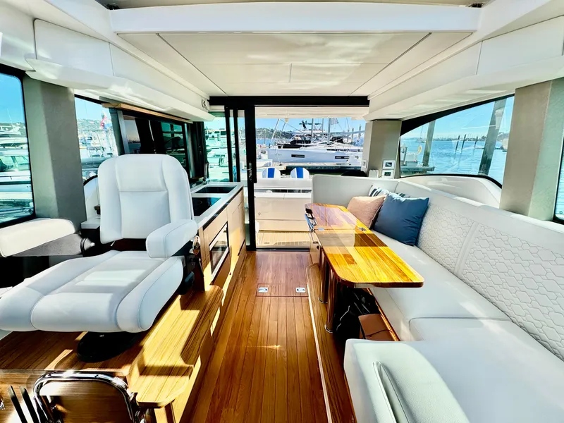 Slide: The Image of Luxurious interior of 2025 Tiara Yachts 43 LE with elegant seating and wooden accents. - 42