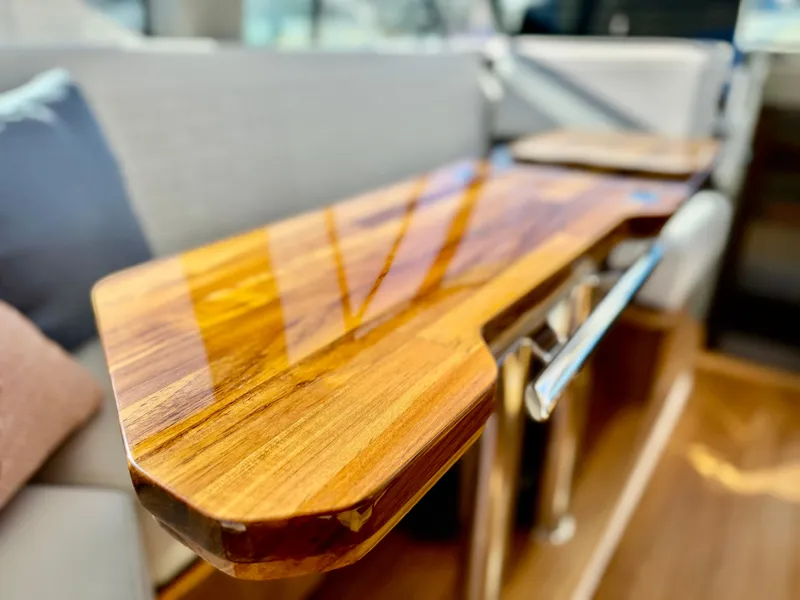Slide: The Image of Luxurious wooden table detail on 2025 Tiara Yachts 43 LE interior. - 43