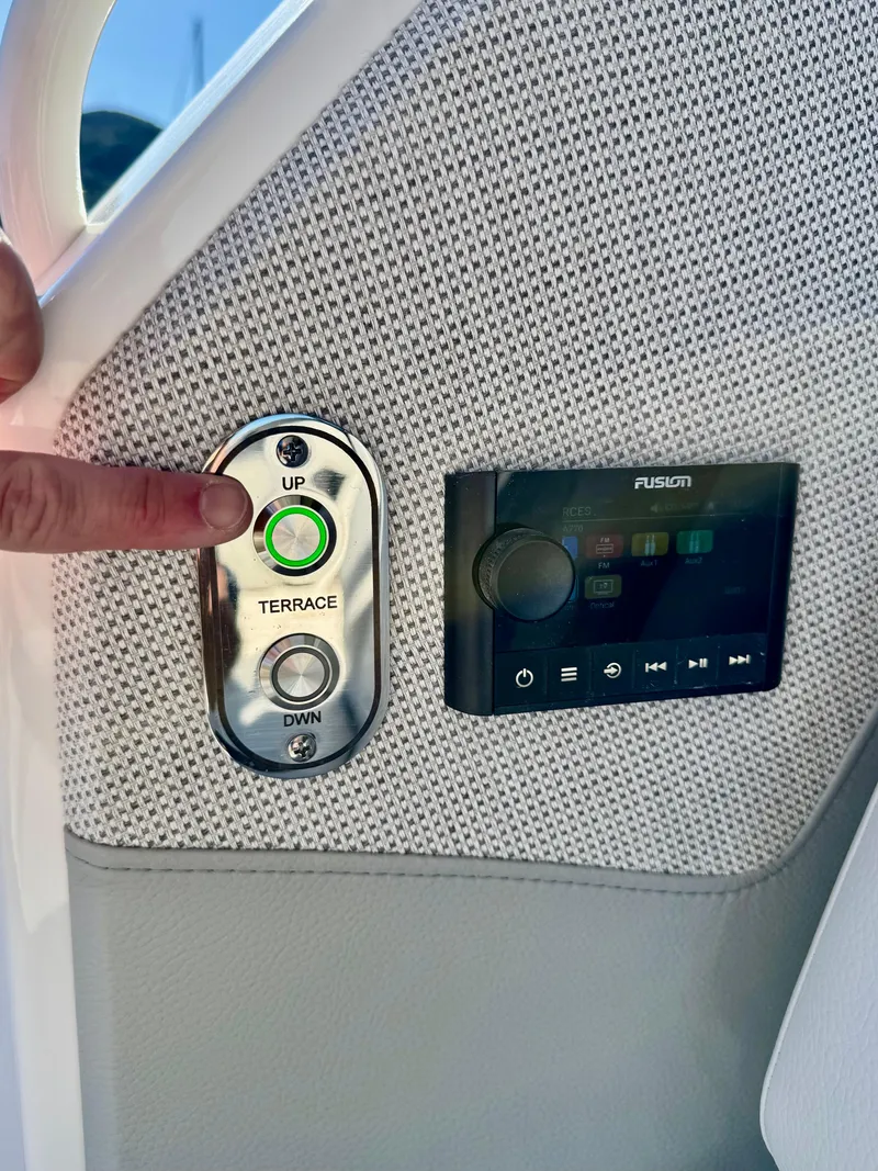 Slide: The Image of Control panel on 2025 Tiara Yachts 43 LE, featuring terrace and audio controls. - 47