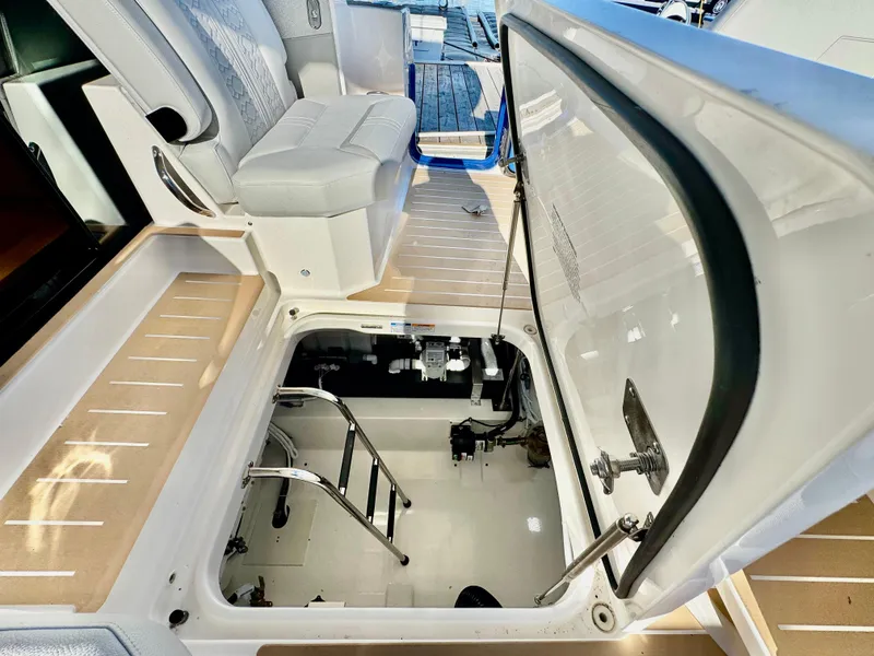 Slide: The Image of 2025 Tiara Yachts 43 LE interior with open hatch and seating area. - 48