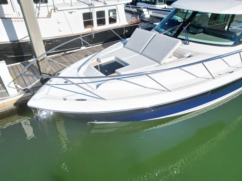 Slide: The Image of 2025 Tiara Yachts 43 LE docked, showcasing sleek design and luxurious seating. - 7