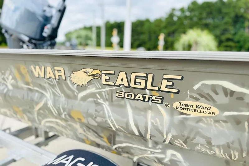 Slide: The Image of 2026 War Eagle 648LDV boat with camouflage design and logo, Monticello AR. - 7