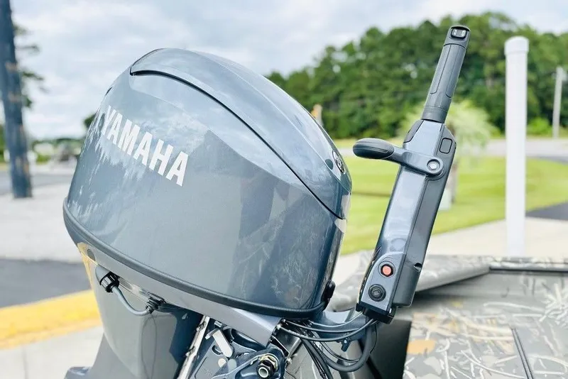 Slide: The Image of 2026 War Eagle 648LDV boat with Yamaha outboard motor, parked outdoors. - 8