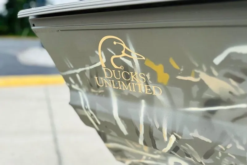 Slide: The Image of War Eagle 648LDV 2026 boat with Ducks Unlimited logo, camouflage design. - 9