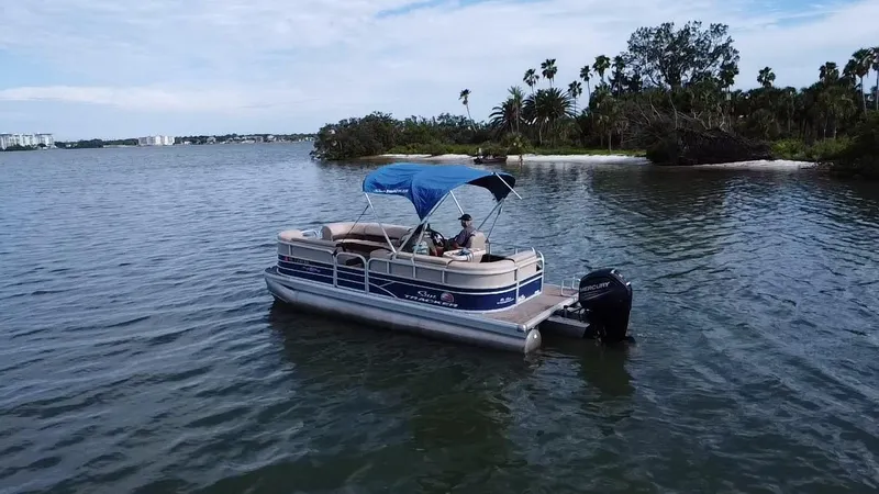 Slide: The Image of 2018 Sun Tracker Party Barge 20 DLX pontoon boat on a scenic lake. - 12