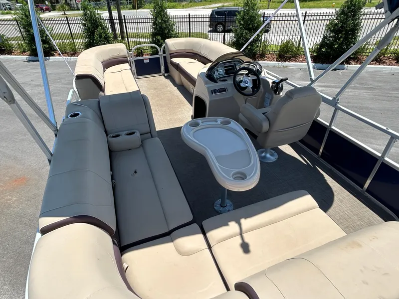 Slide: The Image of 2018 Sun Tracker Party Barge 20 DLX with spacious seating and steering console. - 6