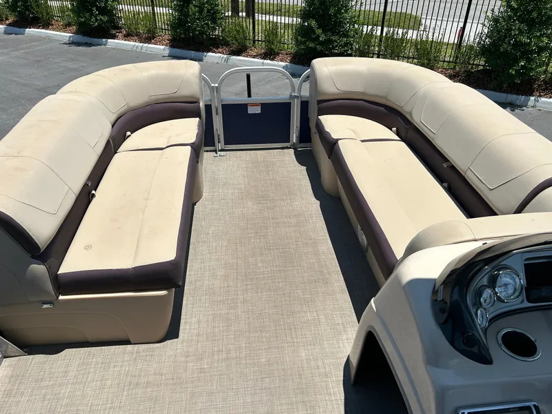 Slide: The Image of 2018 Sun Tracker Party Barge 20 DLX interior with spacious seating and helm. - 7
