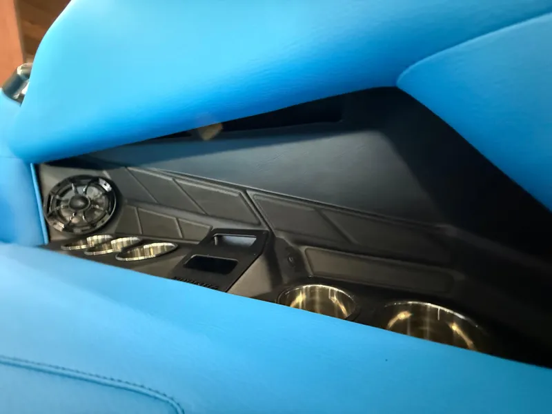 Slide: The Image of 2025 Moomba Tykon interior with blue upholstery and cup holders. - 15