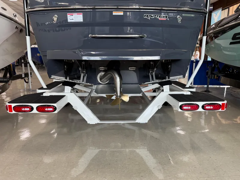 Slide: The Image of 2025 Moomba Tykon boat rear view with Raptor engine and trailer. - 6