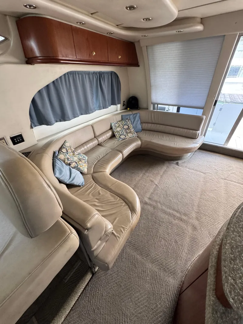 Slide: The Image of Luxurious interior of 1998 Maxum 4600 SCB yacht with plush seating and elegant decor. - 20