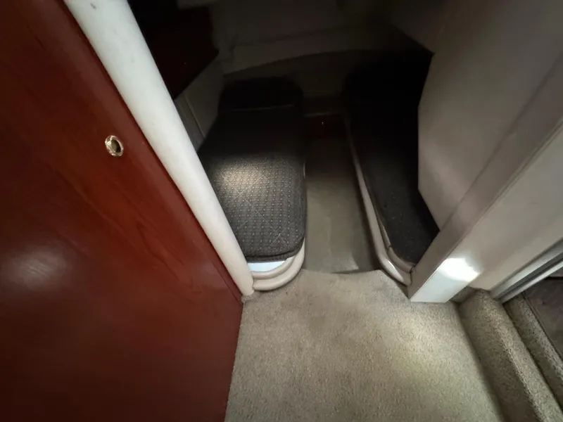 Slide: The Image of Interior cabin of 1998 Maxum 4600 SCB yacht with twin beds and carpeted floor. - 25