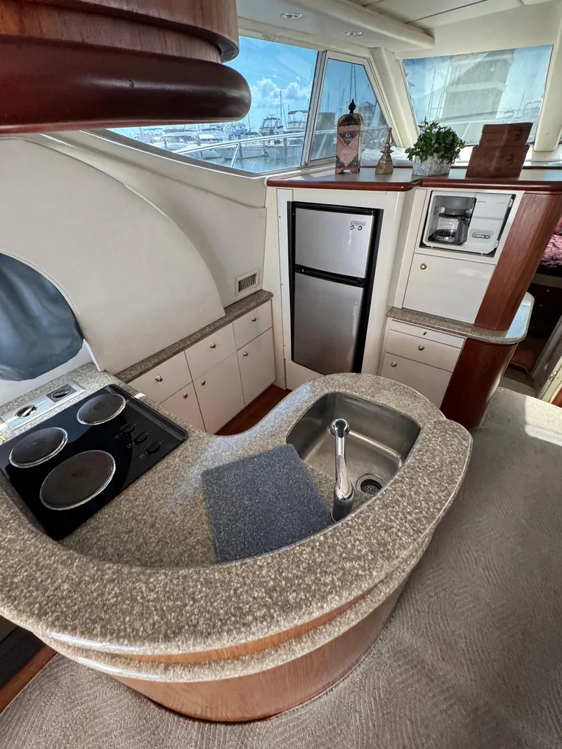 Slide: The Image of Luxurious 1998 Maxum 4600 SCB yacht kitchen with modern appliances and elegant design. - 33