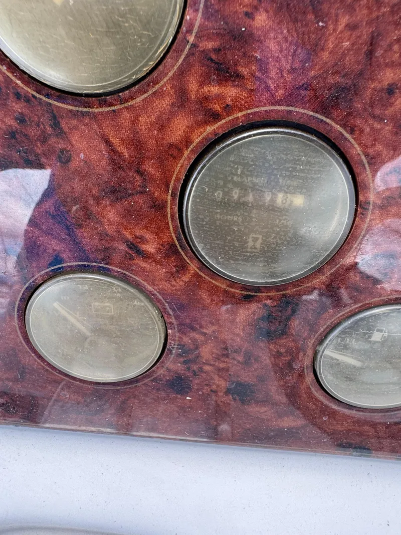 Slide: The Image of Close-up of 1998 Maxum 4600 SCB boat dashboard with circular gauges. - 9