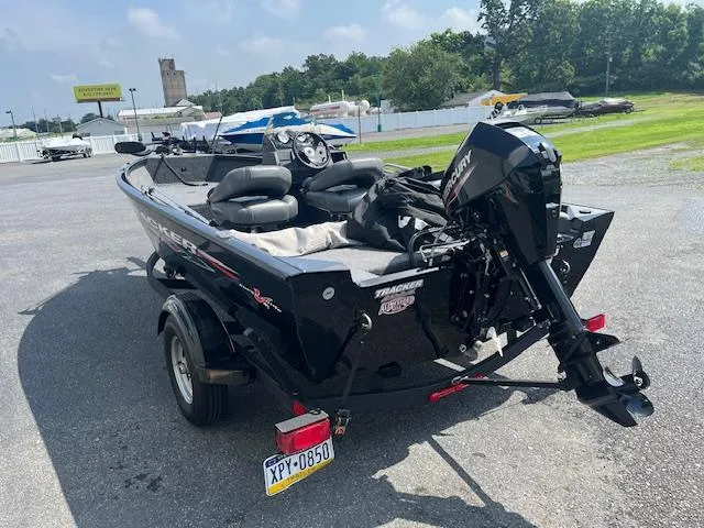 Slide: The Image of 2024 Tracker Super Guide V-16 SC boat on trailer, parked outdoors. - 3