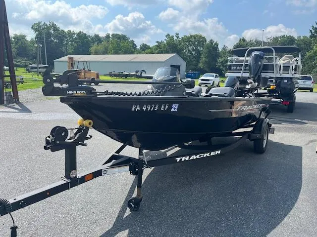 Slide: The Image of 2024 Tracker Super Guide V-16 SC boat on trailer in parking lot, sunny day. - 5