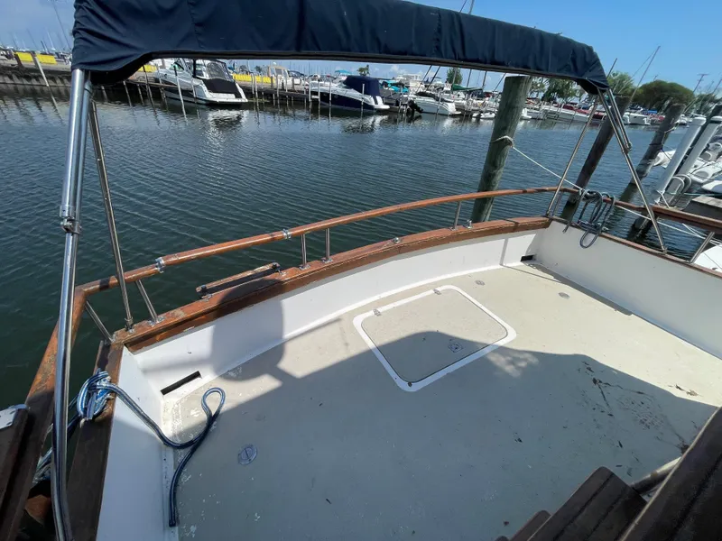 Slide: The Image of 1982 Californian 34 LRC boat deck with railing, docked at marina. - 11