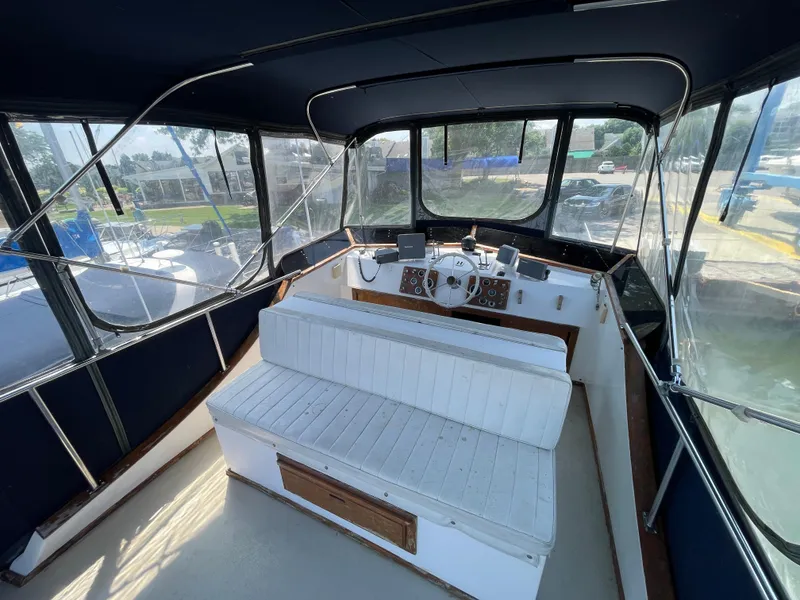 Slide: The Image of Interior view of 1982 Californian 34 LRC boat with helm and seating area. - 14