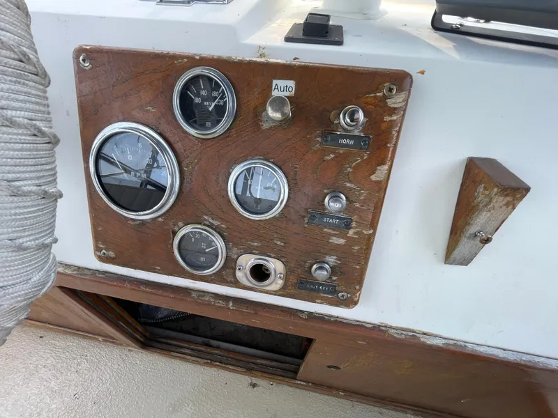 Slide: The Image of Control panel of a 1982 Californian 34 LRC boat with gauges and switches. - 16