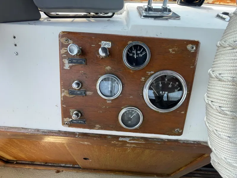 Slide: The Image of 1982 Californian 34 LRC boat dashboard with gauges and controls. - 17